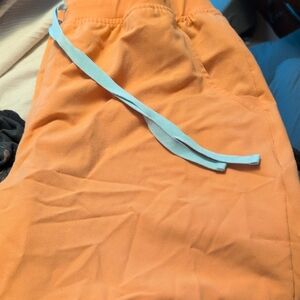 Figs Bright Orange Joggers with Light Blue Draw String.
